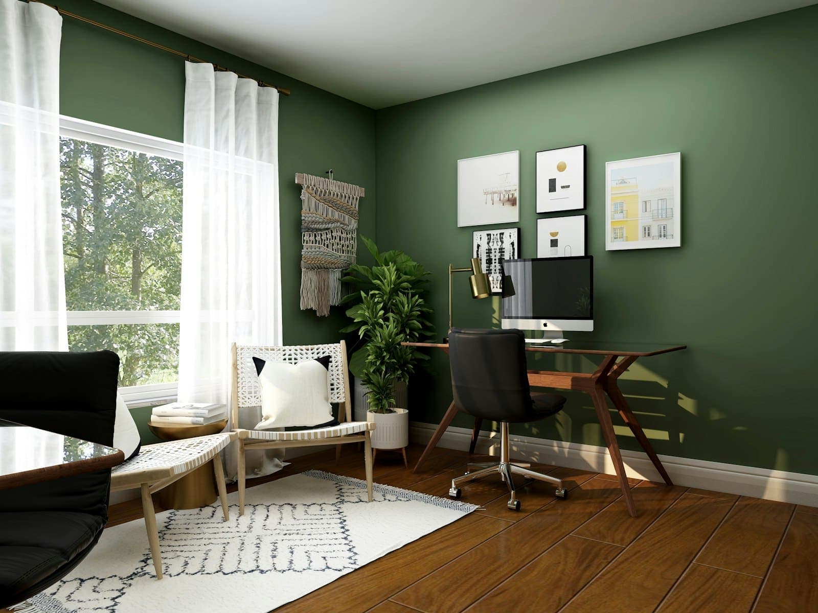 A home office with a desk and chair by a large window, green walls and a patterned rug